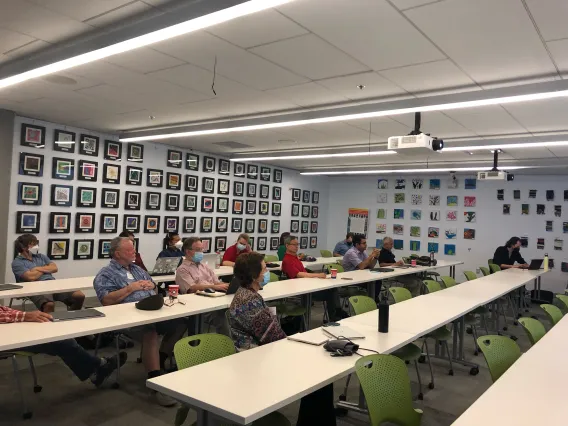 Workshop attendees gathered in a conference room.