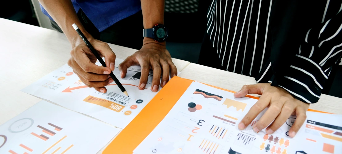 Stock photo of analysts working on data reports.